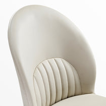 Off-White Leather Dining Chair Back Detail. Chic, Upholstered Design for Modern Dining Spaces.