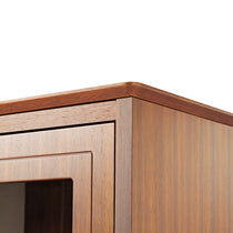 Walnut Bookcase Corner Detail. Glass Doors and Cabinet Design for Stylish Storage.