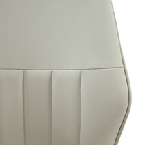 Gray Upholstered Dining Chair Backrest Detail With Vertical Stitching, Part of the Ember Dining Set.