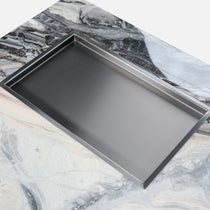 Close-Up Detail of Square Marble Coffee Table With Sunken Desktop and Stainless Steel Tray.