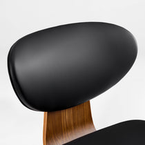 Belmar Black Leather Dining Chair's Ergonomic Backrest and Wood Frame Detail, Modern Dining Room Furniture.