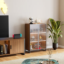 Modern Curio Cabinet With Led Lighting, Glass Doors and Adjustable Shelves, Showcasing Collectibles in a Living Room Setting.