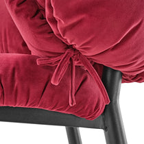 Rlesana Velvet Dining Chair Detail, Showing Red Velvet Upholstery and Black Metal Frame.