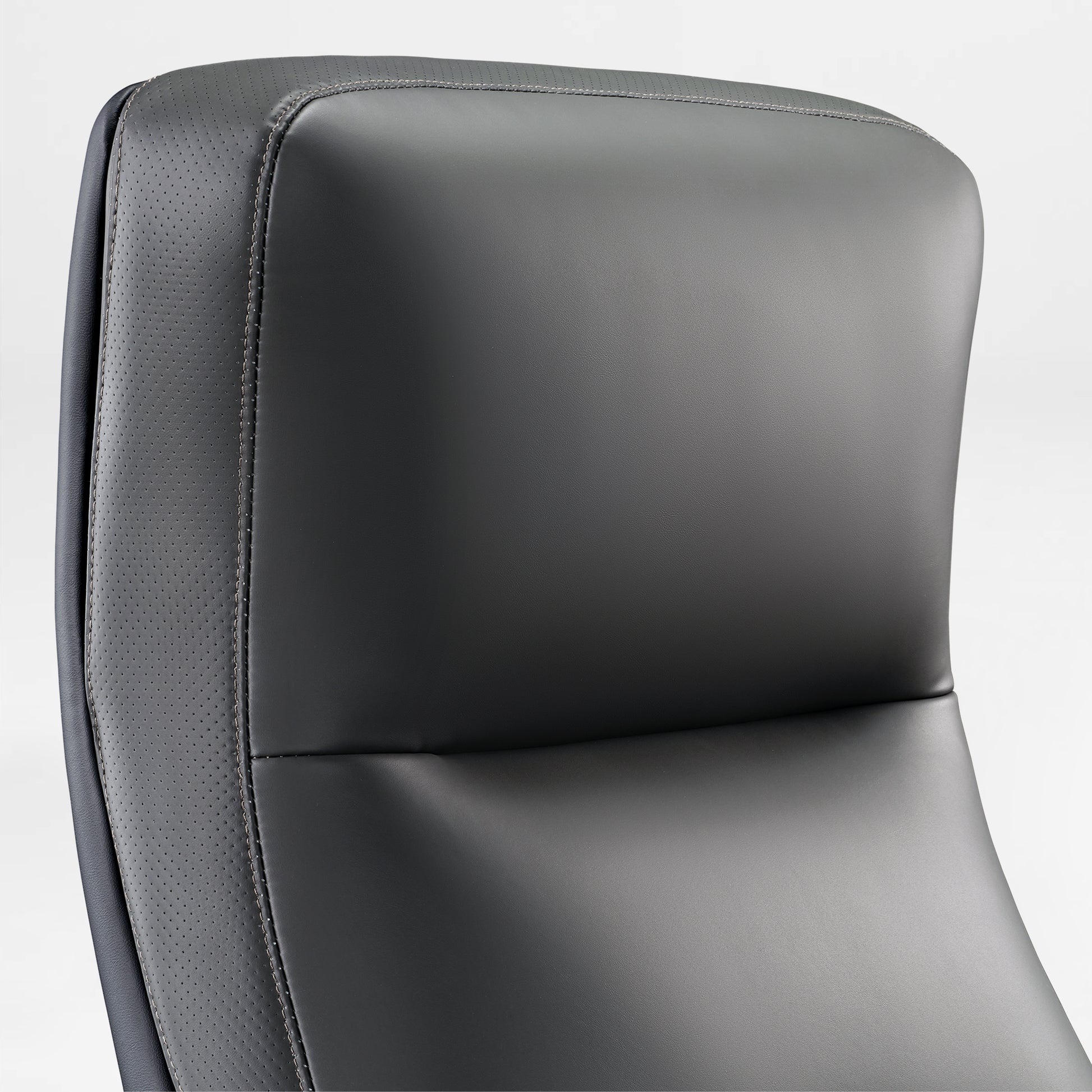 Royal II Executive Office Chair Headrest Detail, Featuring Gray Leather With Perforated Accents and Ergonomic Design.