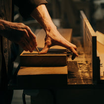 Craftsman Marking Wood for Ark Sws Pro Executive Desk, Highlighting Quality Craftsmanship and Materials.