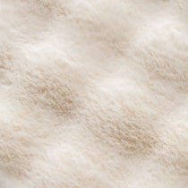 Close-Up of Soft, Plush Cat Bed Cushions in a Light Beige Color, Showcasing Texture and Comfort for Pets.