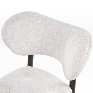 Nibbles Upholstered Dining Chair Detail. White Geometric Fabric, Dark Legs. Modern Dining Room Seating.