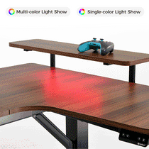 Eureka Ergonomic U-shaped standing desk with dark wood grain, monitor riser, teal controller, and red LED lighting on page showing desk accessories.