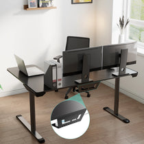 Black L-Shaped Gaming Desk With Triple Monitors and Cable Management for Ergonomic Setup.