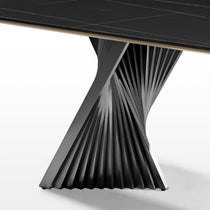 Eureka Ergonomic Oasis black sintered stone dining table, gold edge, twisted metal base. Unique design detail.