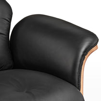 Matteo Lounge Chair Close-Up, Black Leather Detail, Wooden Accents, Luxury and Comfort.