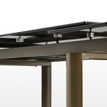 Savoy Extendable Dining Table Detail: Black Sintered Stone Surface, Metal Supports, Modern Design and Extending Mechanism.
