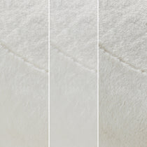 White Upholstered Swivel Chair Fabric Detail, Soft Textured Material, Perfect for Modern Living Spaces.