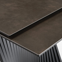 Charlotte Extendable Dining Table Detail, Showing Sintered Stone Desktop and Black Metal Legs.