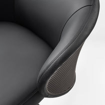 Eureka Ergonomic Close-up of Royal Rowan black executive chair armrest, perforated microfiber leather with ribbed gray detail and stitching.