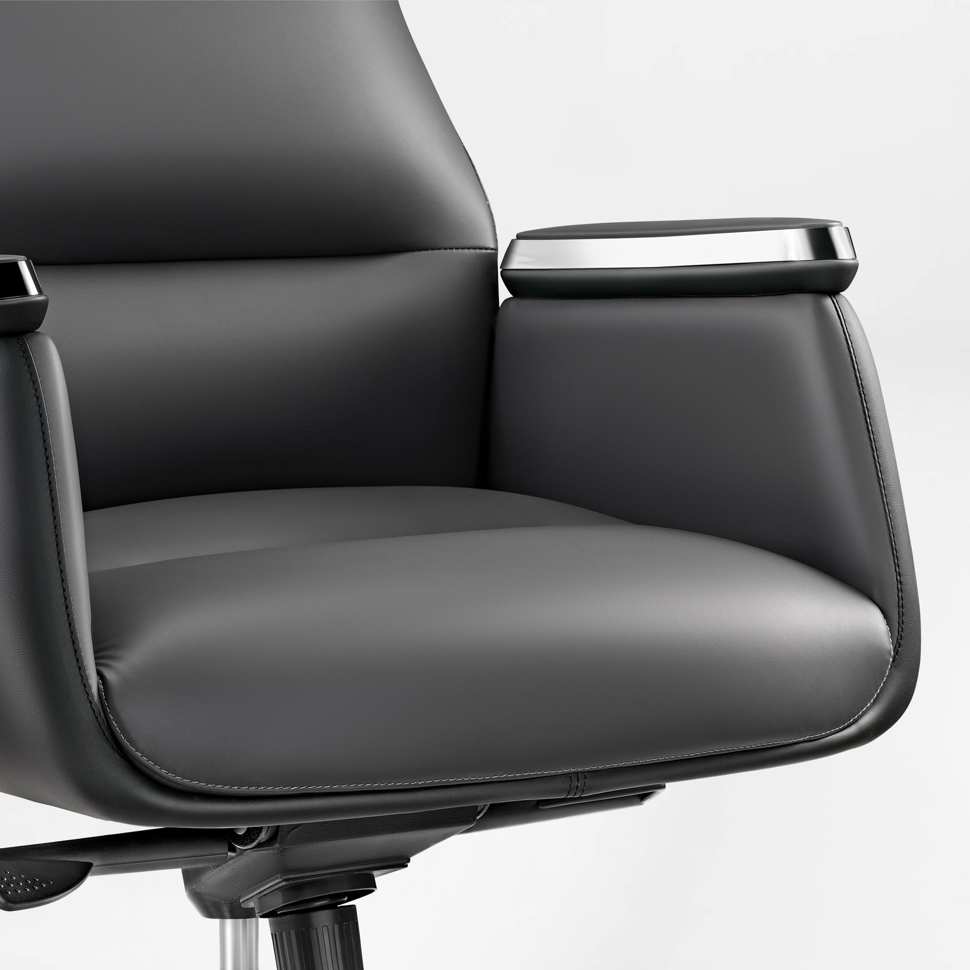 Royal II Executive Office Chair Detail: Black Leather Armrest With Silver Trim and Ergonomic Design.