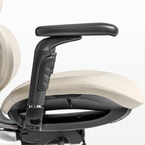 Eureka Ergonomic Light beige Forma ergonomic chair seat cushion and black armrest detail, showing PU leather stitching and matte finish.