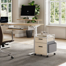 Modern Home Office With Rolling File Cabinet, Light Wood Desk, and Ergonomic Chair for Efficient Organization.