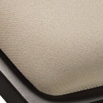Eureka Ergonomic Close-up of textured cream seat cushion on dark wood Mila dining chair, showcasing fabric weave and smooth finish.