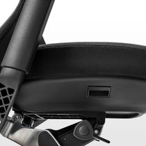 Eureka Ergonomic Lira ergonomic office chair close-up of seat adjustment lever and tilt control knob, textured fabric seat detail.
