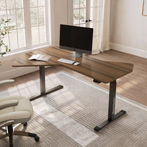 Eureka Ergonomic Blossom Dynamics 70-inch L-shaped standing desk with dark wood grain, T-base in home office with computer setup.