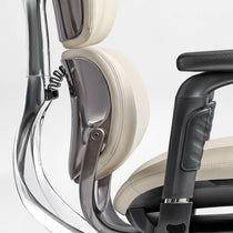 Eureka Ergonomic Light beige Forma ergonomic chair headrest and lumbar support close-up, PU leather with stitching, aluminum frame detail.