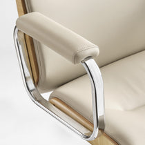 Eureka Ergonomic close-up of the beige Mathias Mason chair's chrome armrest and padded arm support