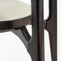 Cedar Dining Chair Detail: Off-White Leather Seat and Dark Wood Frame, Modern Dining Set Element.