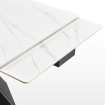 Evelyn Extendable Dining Table Detail Showing White Sintered Stone Surface and Extending Mechanism.