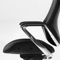Eureka Ergonomic Nox black genuine leather executive chair armrest detail with polished chrome and seat stitching on white background.