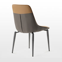 Couture Dining Chair in Turmeric & Gray Leather, Modern Ergonomic Design. Featuring Gray and Tan Leather With Metal Legs.