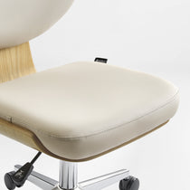 Eureka Ergonomic Off-white faux leather office chair seat with stitching, curved light wood veneer shell, and chrome height lever.