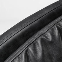 Eureka Ergonomic Black PU leather upholstery on Regal office chair, showcasing precise stitching and material texture.