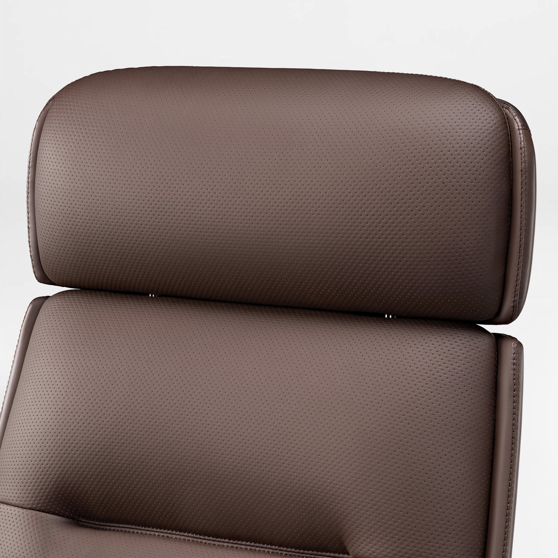 Eureka Ergonomic Close-up of brown microfiber leather executive office chair headrest and seat, showing perforated texture for breathability.