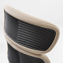 Eureka Ergonomic Close-up of beige Royal Rowan executive chair showing perforated microfiber leather and ribbed black backrest detail.