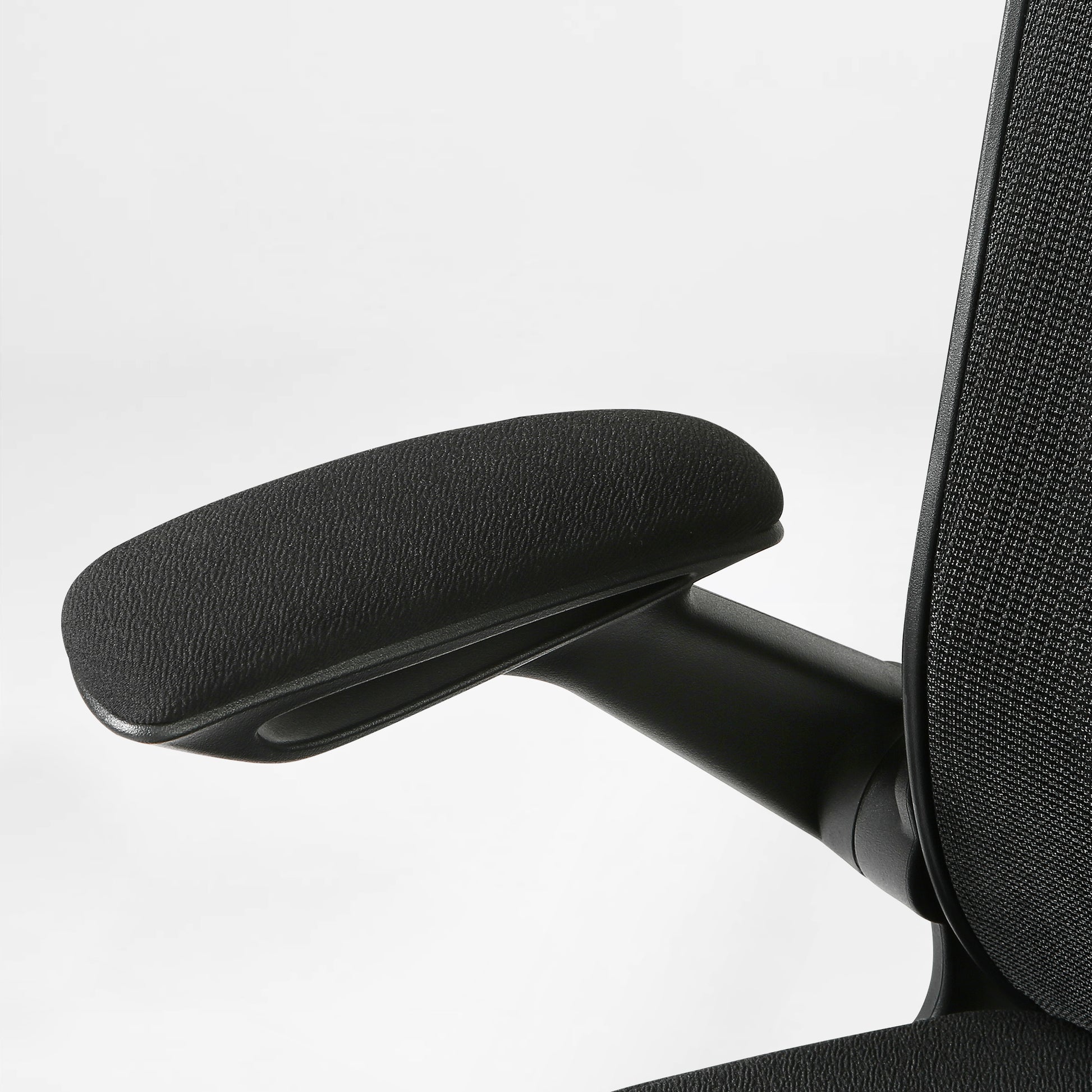 Onyx Ergonomic Office Chair Detail: Black Padded Armrest, Mesh Back, Ergonomic Design.