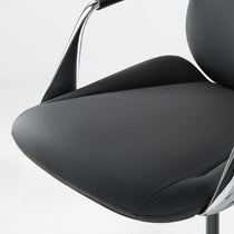 Eureka Ergonomic Serene Aaron black leather executive chair seat detail: smooth texture, stitching, chrome armrest. Product appearance.