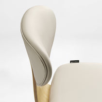 Eureka Ergonomic Off-white faux leather office chair close-up, showing stitching and light wood veneer shell.