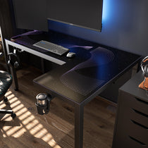 Eureka Ergonomic GTG L-Shaped Glass LED Gaming Desk with dynamic RGB lighting, keyboard, mouse, cup holder, and headphone hooks.