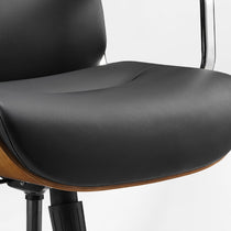 Eureka Ergonomic close-up of the black Mathias Mason chair's seat cushion and walnut side detail