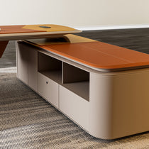 Eureka Ergonomic Zen Altair executive desk with wood and burnt orange faux leather panels, taupe base, and white stitching on grey rug.