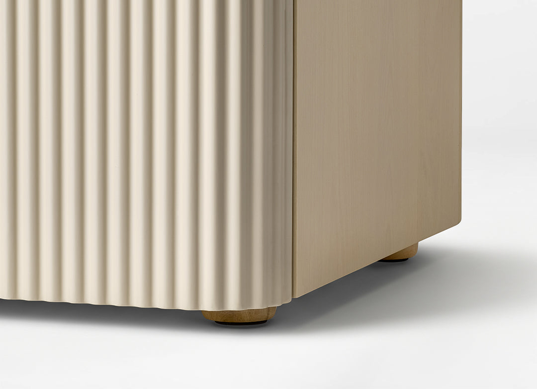 Eureka Ergonomic Opal file cabinet base detail showing the fluted side panel and round wooden feet with glides