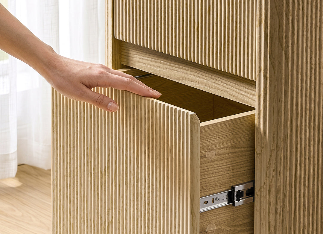 Eureka Ergonomic Aurelia file cabinet top drawer opened by hand using the integrated recessed handle