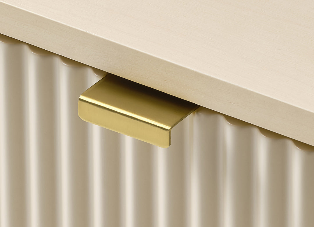 Eureka Ergonomic Opal file cabinet brass pull detail from below, showing the angled tab handle in profile