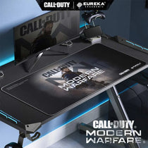 Call of Duty Modern Warfare Mousepad By Eureka Ergonomic On a Gaming Desk Setup, Black Design Featuring a Character.