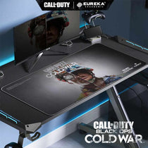 Call of Duty Black Ops Cold War Mouse Pad By Eureka Ergonomic On Gaming Desk, Black Design Featuring Character Graphic.