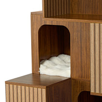 Eureka Ergonomic Close-up of Pawlio 72" bookshelf cat tree showcasing fluted wood panels and a plush white cushion in a cubby.
