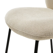 Sage Dining Chair Detail, Off-White Textured Upholstery, Black Metal Legs. Modern Dining Chair.