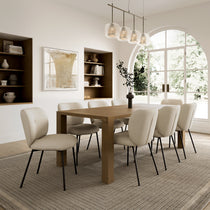 Sage Dining Set in a Modern Dining Room; Off-White Chairs With Black Legs, Wooden Table, and Neutral Decor.