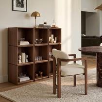 Eureka Ergonomic Cubo walnut rotating storage cubes — three units placed side by side against the wall to form a nine-cube grid storage cabinet, styled in a warm-toned dining area.